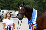 Jeri with horse, both displaying ribbons